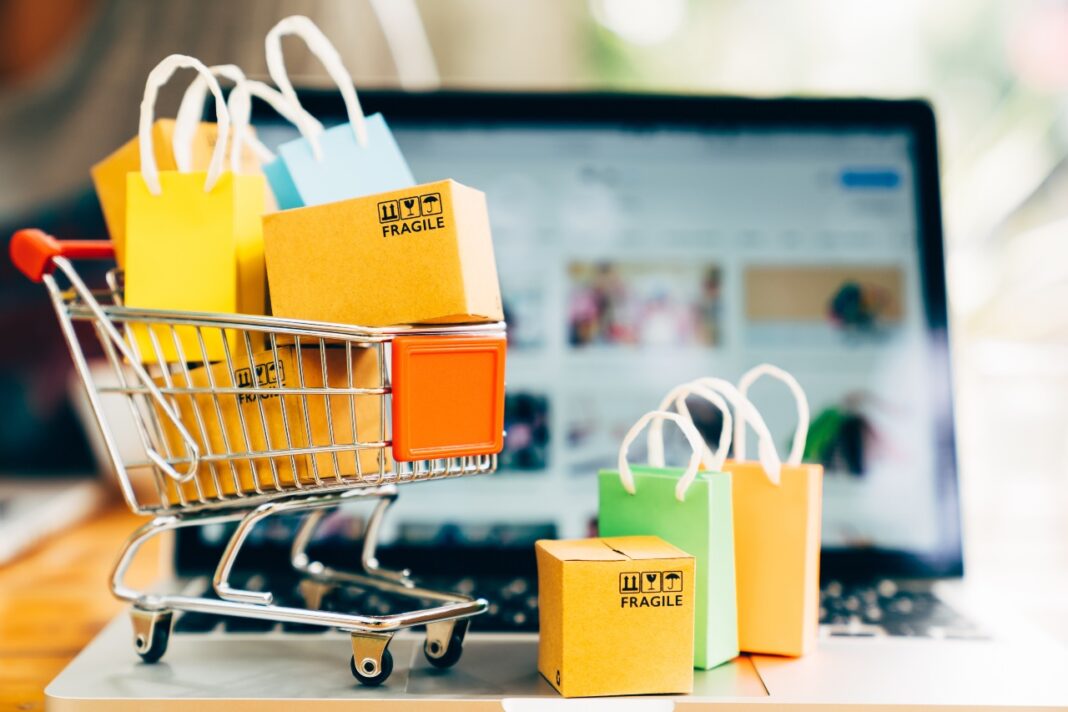 product-package-boxes-shopping-bag-cart-with-laptop-online-shopping-delivery-concept-2